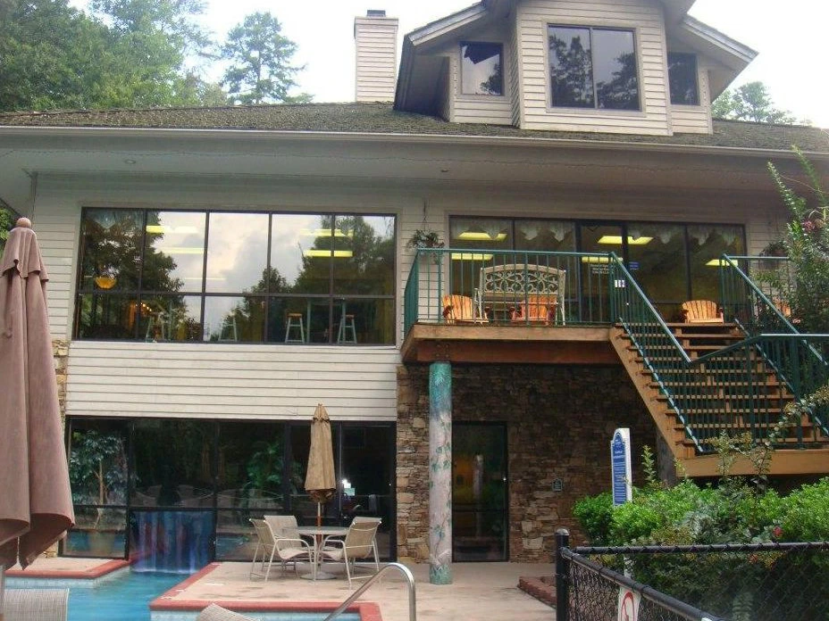 Enjoy the outdoor pool at this beautiful timeshare in gatlinburg, surrounded by lush forest trees.