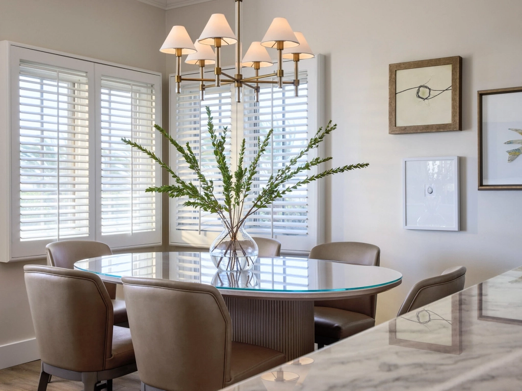 Glass-topped table and comfortable seating in a bright dining room at Four Seasons Residence Club Aviara.