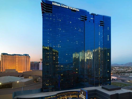 The iconic blue mirror-glass exterior of the Elara resort tower in Las Vegas.