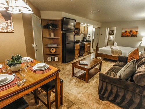 Open concept suite featuring a dining table, small kitchen, and sleeping area at a Timeshare in Sedona.