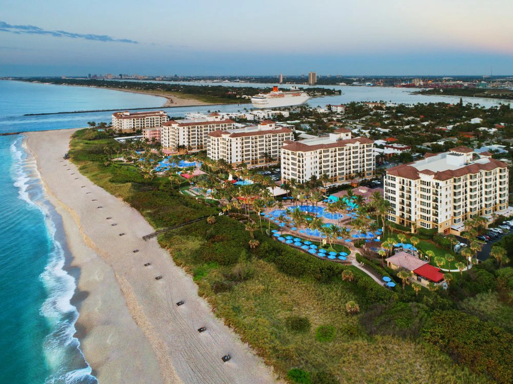 Aerial view of Marriott's Ocean Pointe resort featuring multiple buildings, pools, and a sandy beachfront.